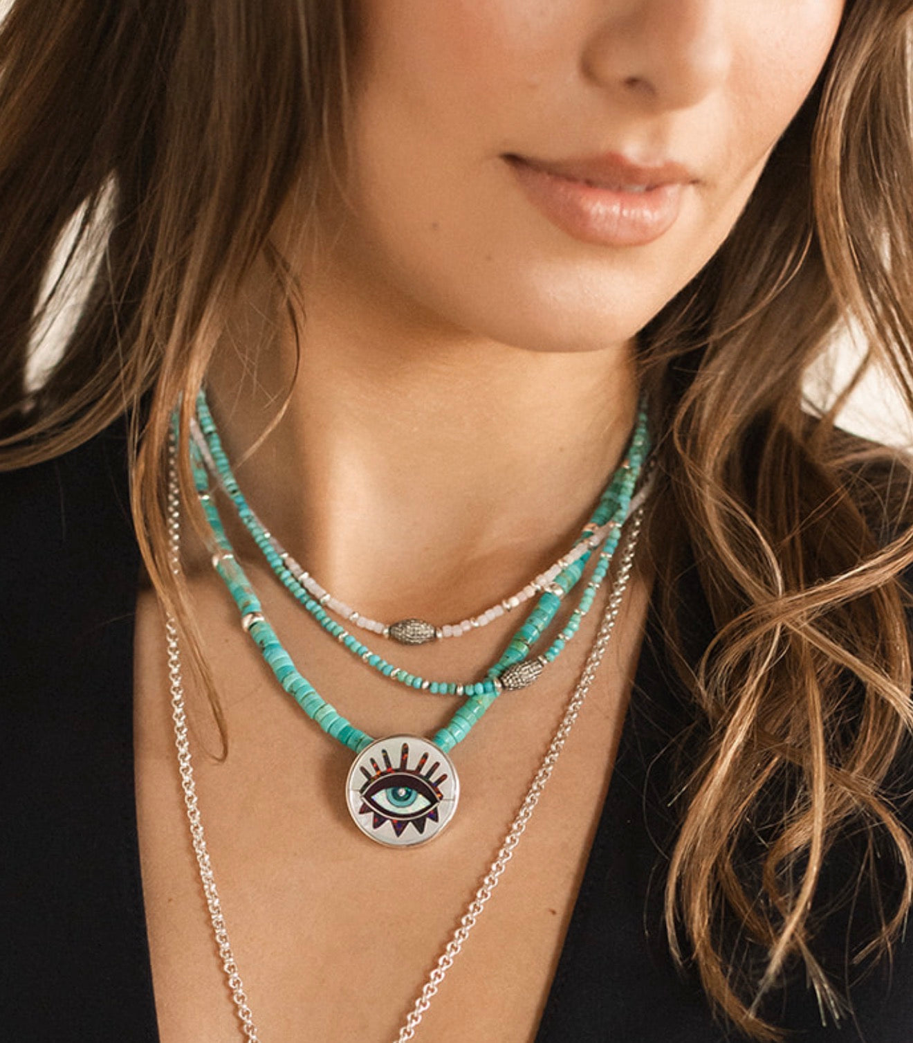 SILVER EVIL EYE ON TURQUOISE GEMS