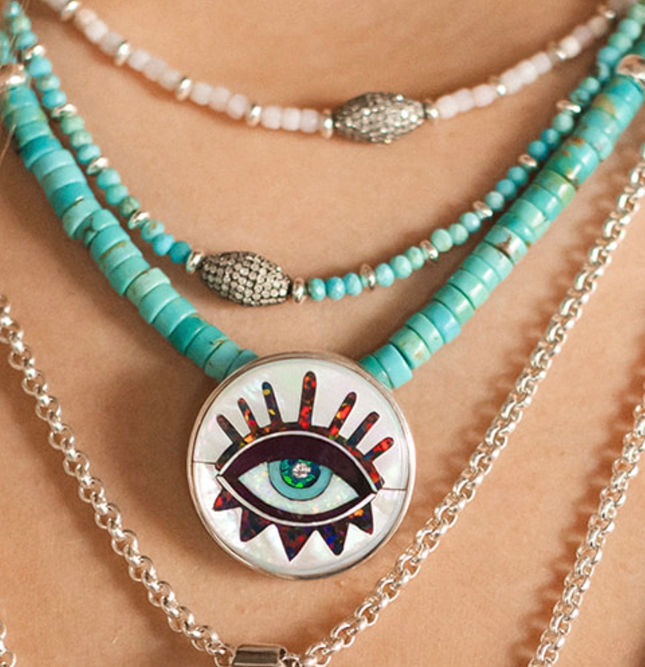 SILVER EVIL EYE ON TURQUOISE GEMS