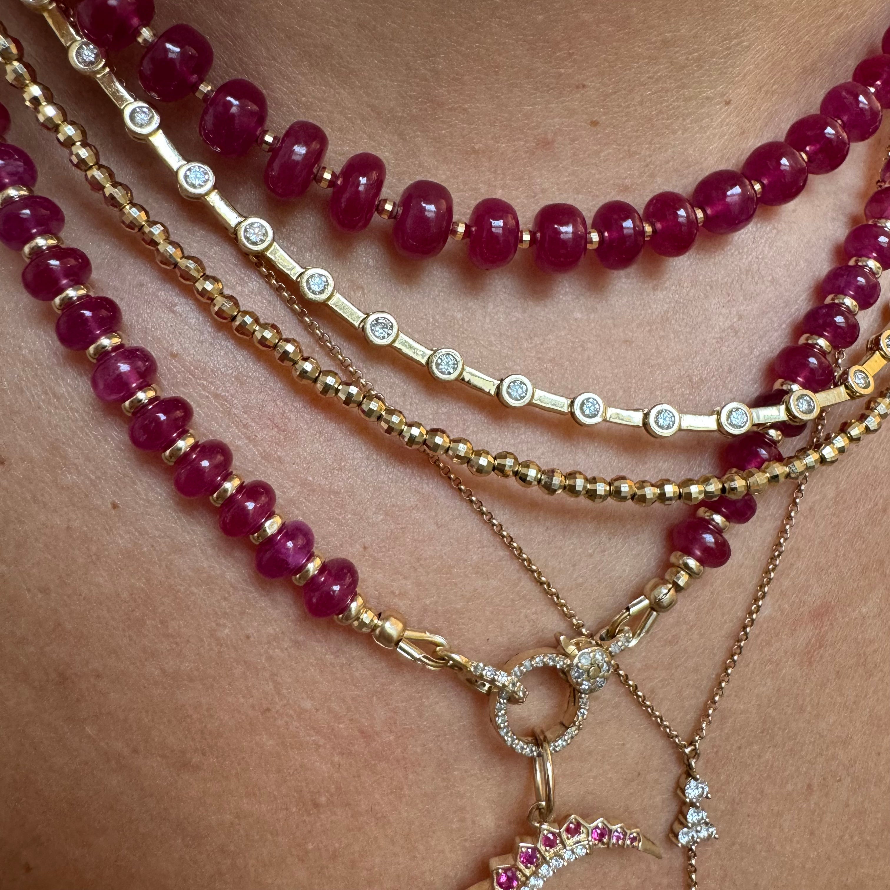 14K GOLD & RUBY NECKLACES. PLAIN STRAND WITH GOLD BEADS OR DIAMON CROSS STYLE