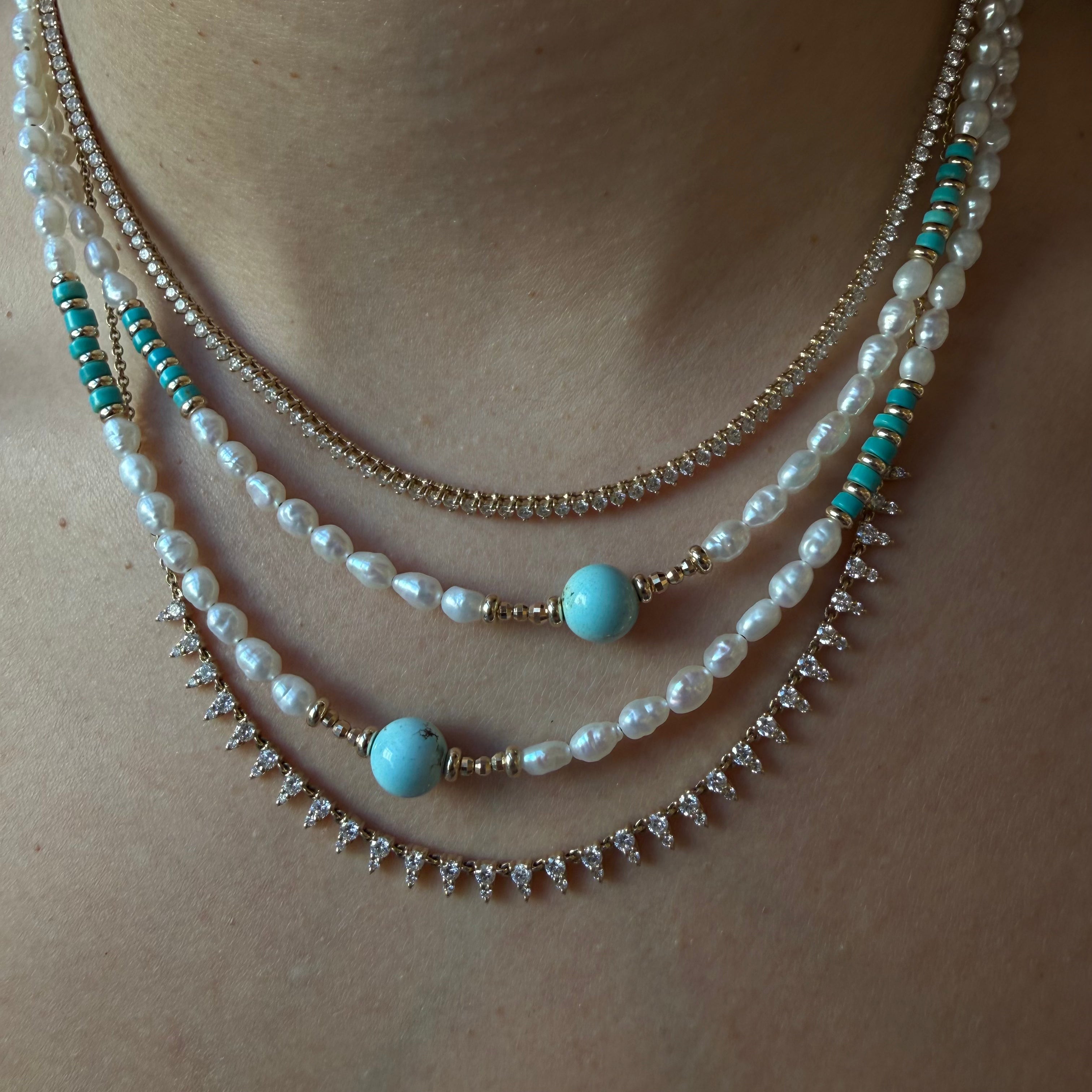 THE WHITE PEARLS WITH TURQUIOSE