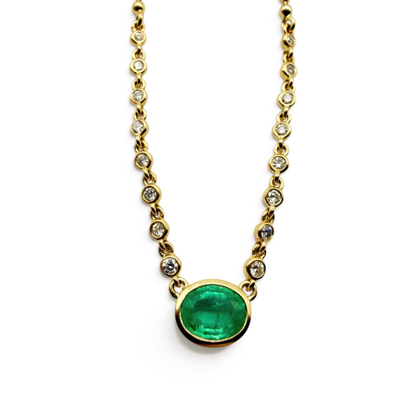 14K GOLD EMERALD AND DIAMOND HALO NECKLACE