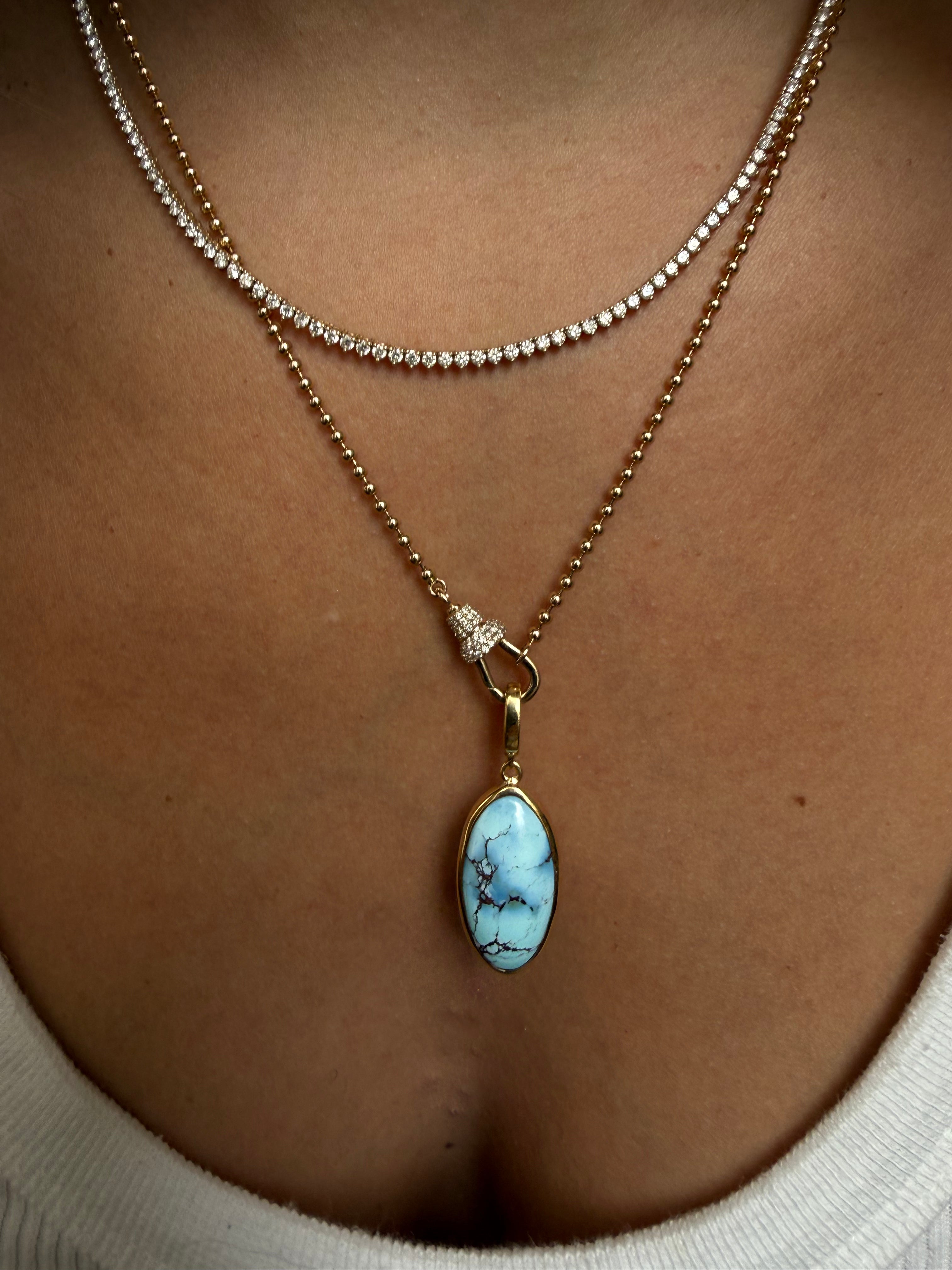 GOLDEN HILL PENDANT SET IN SOLID GOLD
