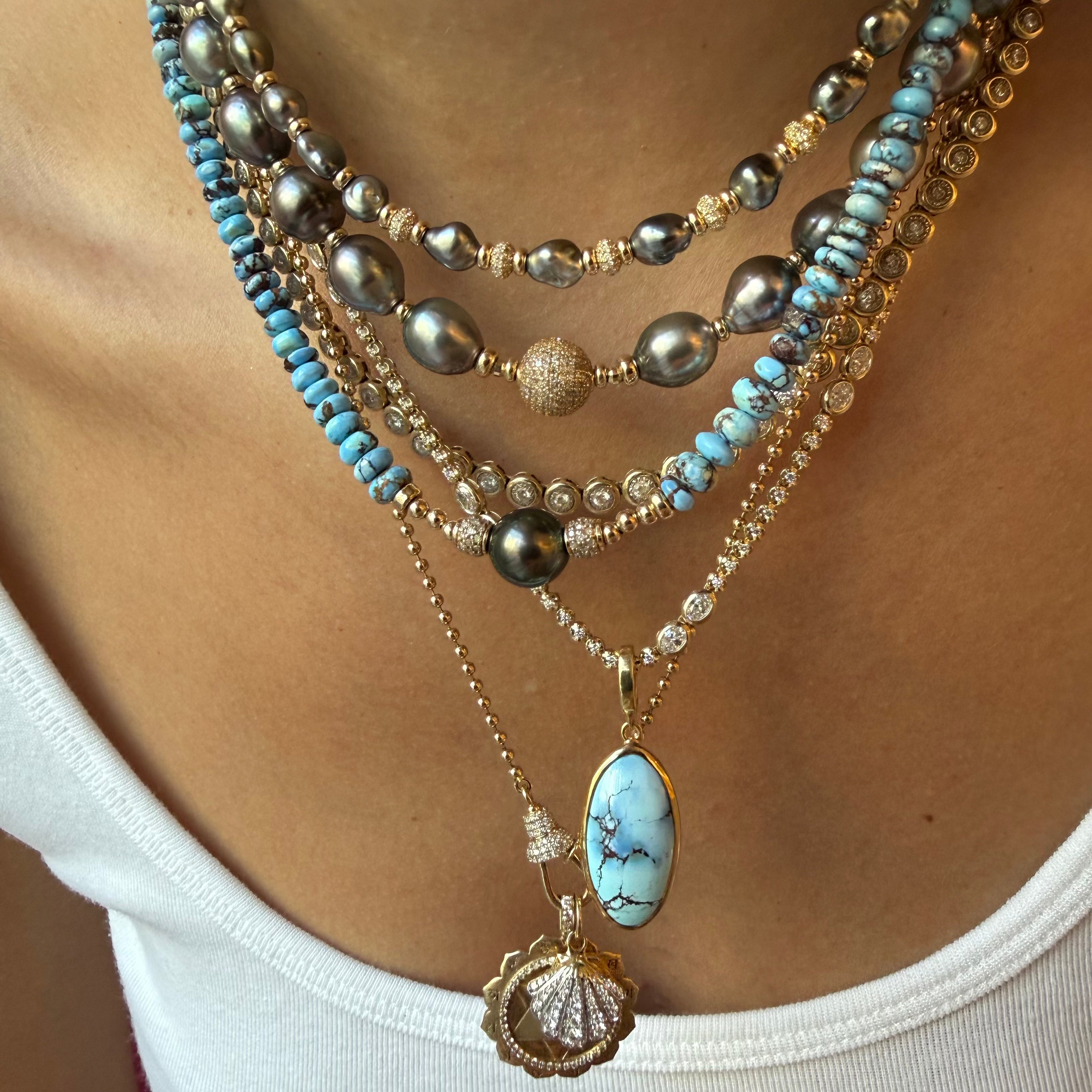 GOLDEN HILL PENDANT SET IN SOLID GOLD