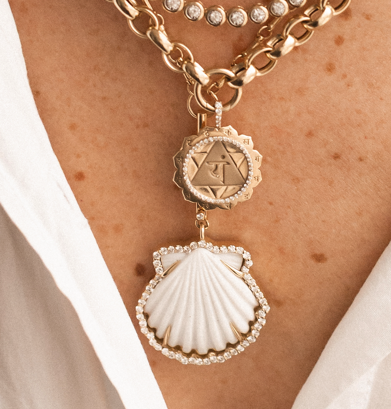 CARVED WHITE SHELL AMULET SET IN SOLID 14K GOLD WHITE DIAMONDS