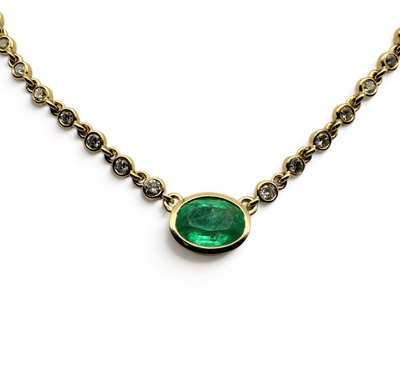 14K GOLD EMERALD AND DIAMOND HALO NECKLACE