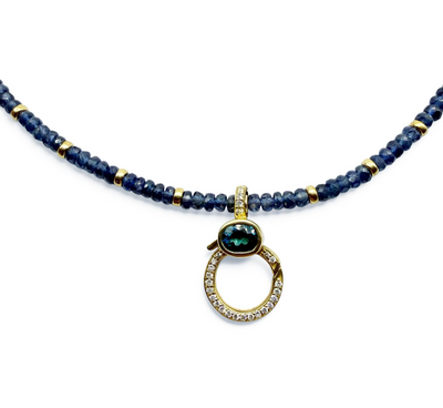 BLUE SAPPHIRE NECKLACE WITH GOLD AND DIAMOND AND TOPAZ CHARM HOLDER