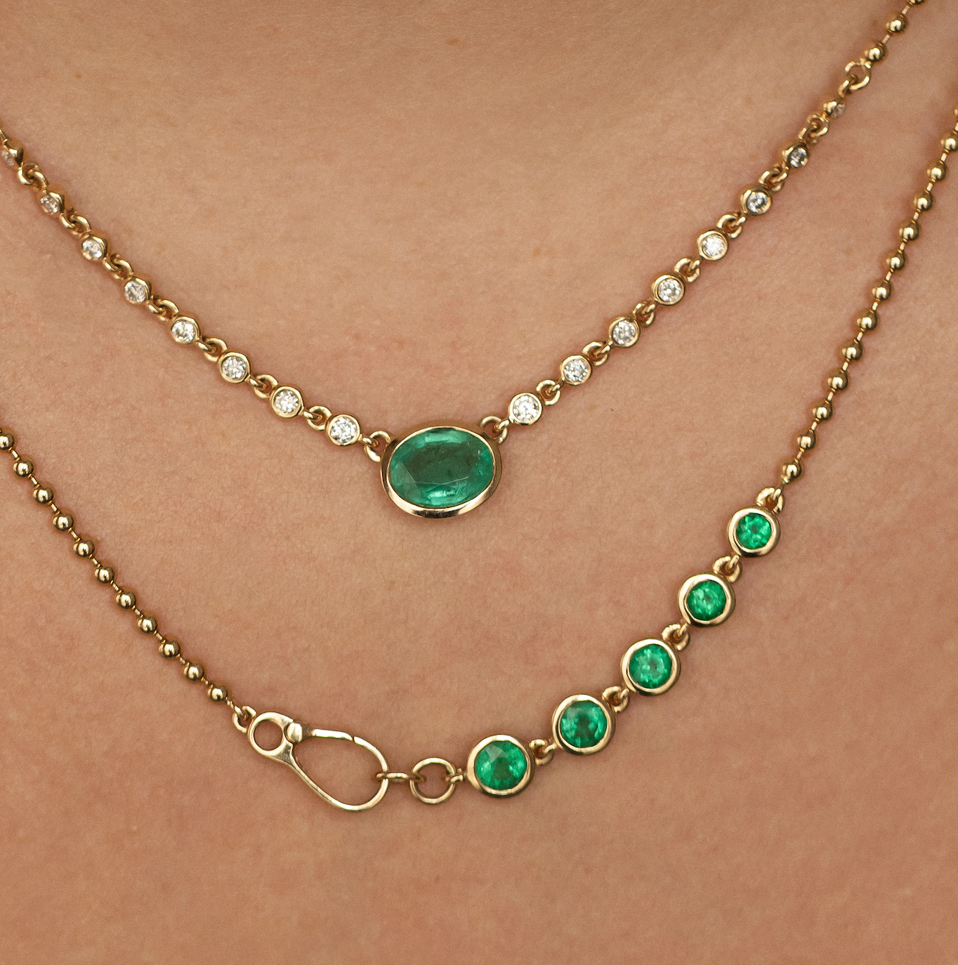 14K GOLD EMERALD AND DIAMOND HALO NECKLACE