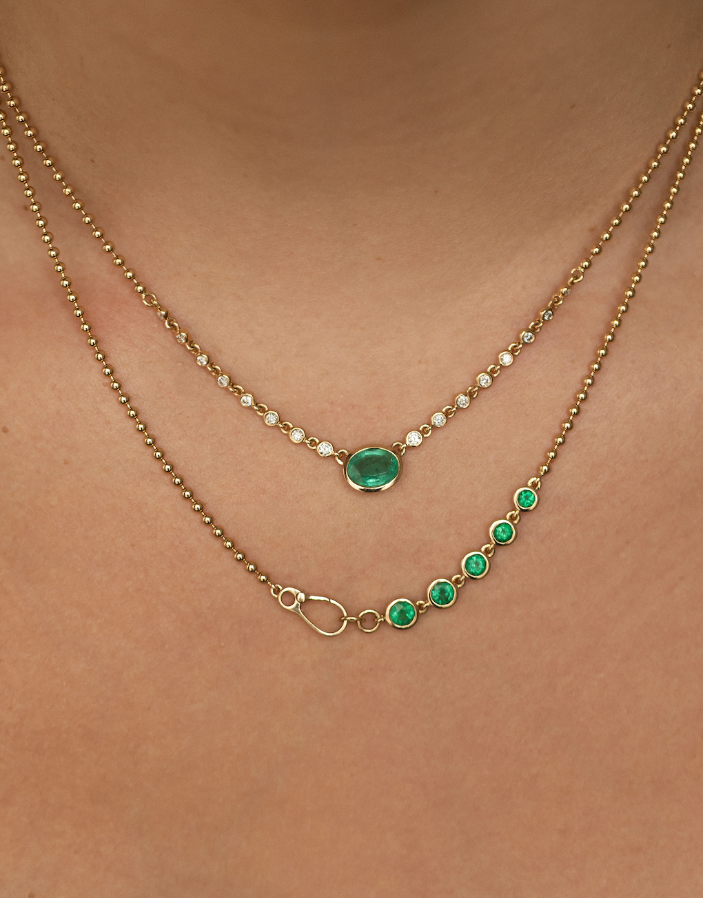 14K GOLD EMERALD AND DIAMOND HALO NECKLACE